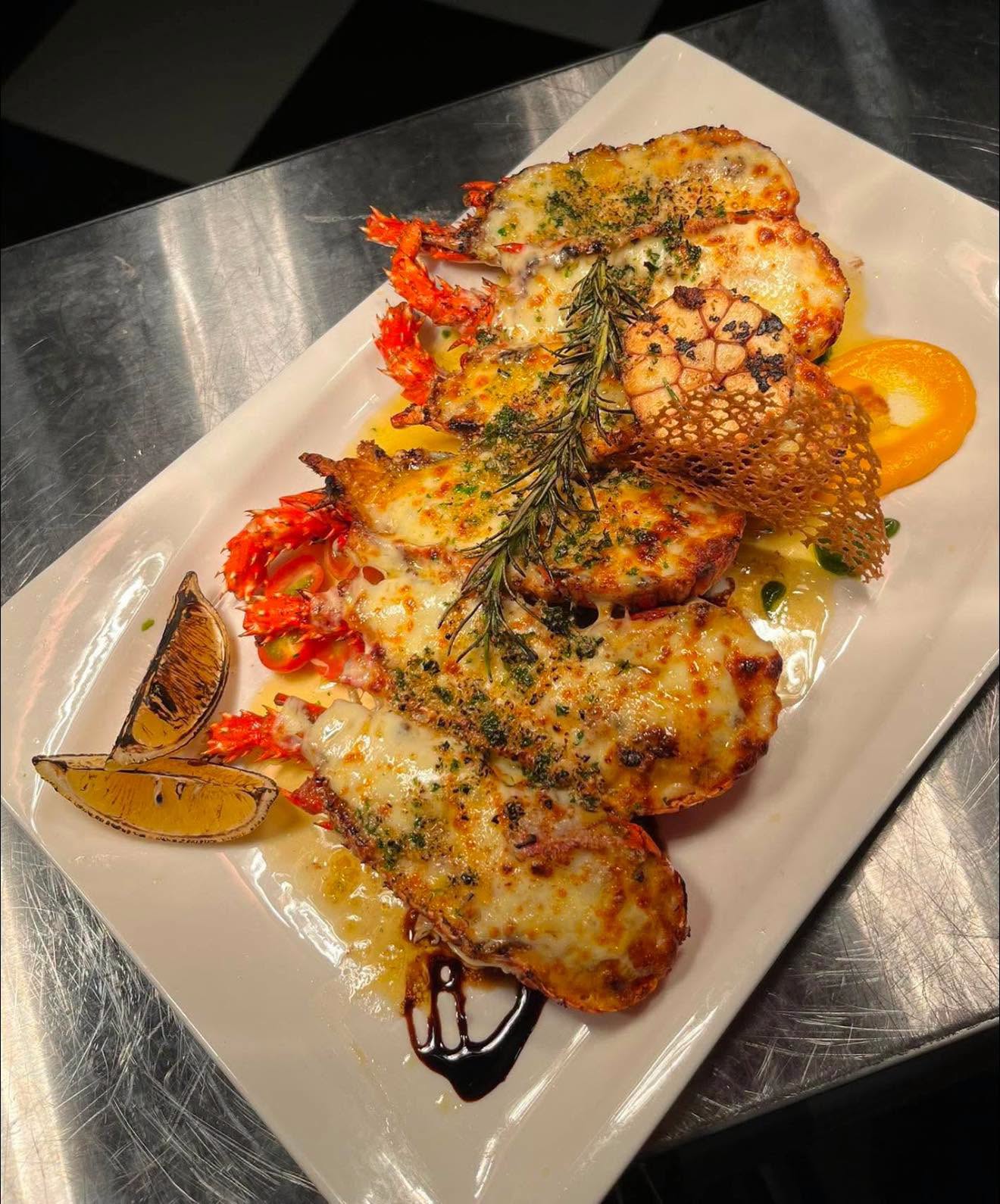 Baked lobster topped with melted cheese