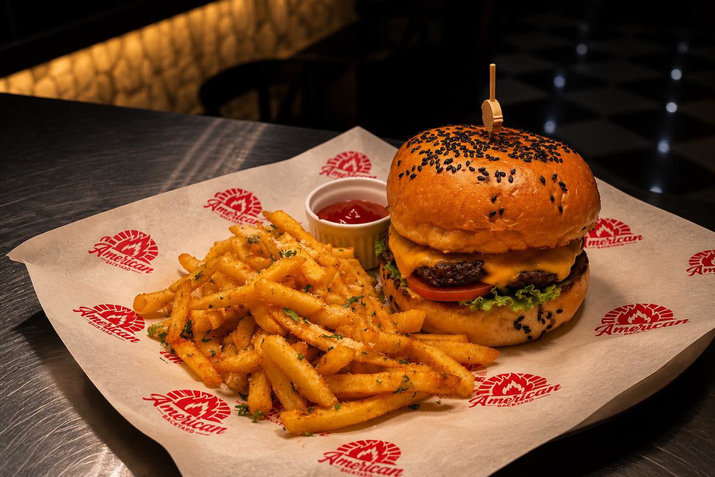 Cheeseburger served with seasoned fries