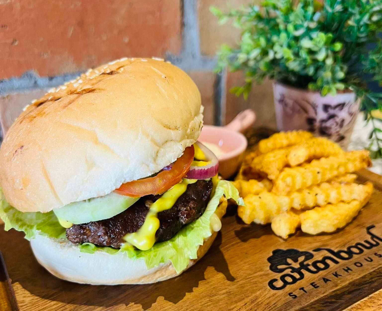 Cotton Bowl burger served with crinkle-cut fries
