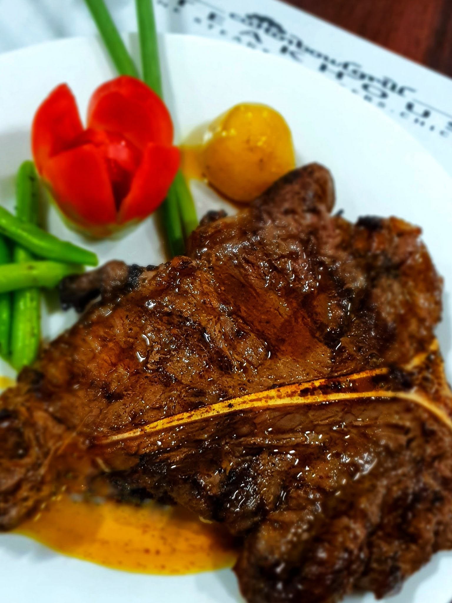 T-bone steak served with vegetables and potato