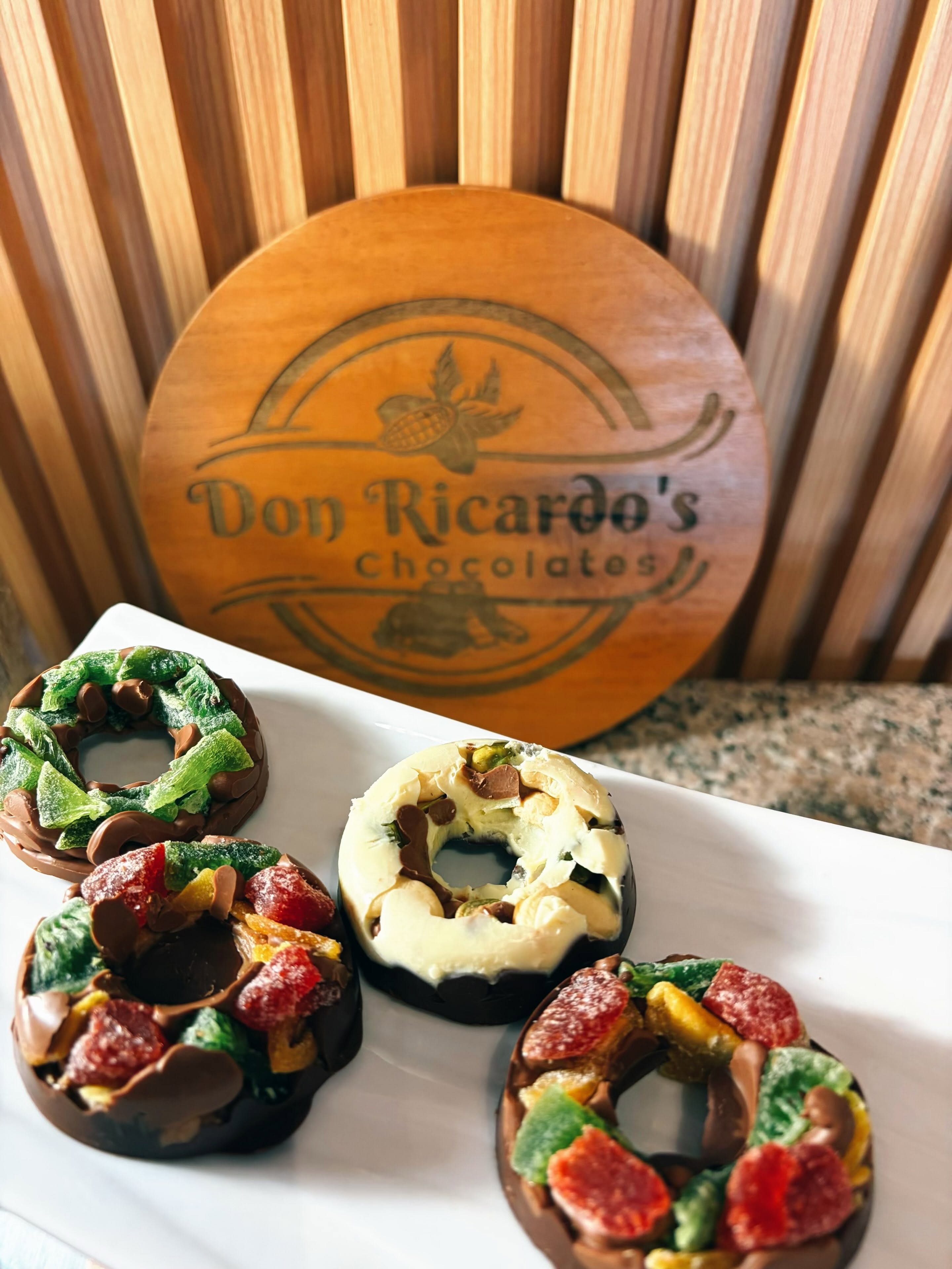 Chocolate rings topped with colorful candied fruit at Don Ricardo Chocolates