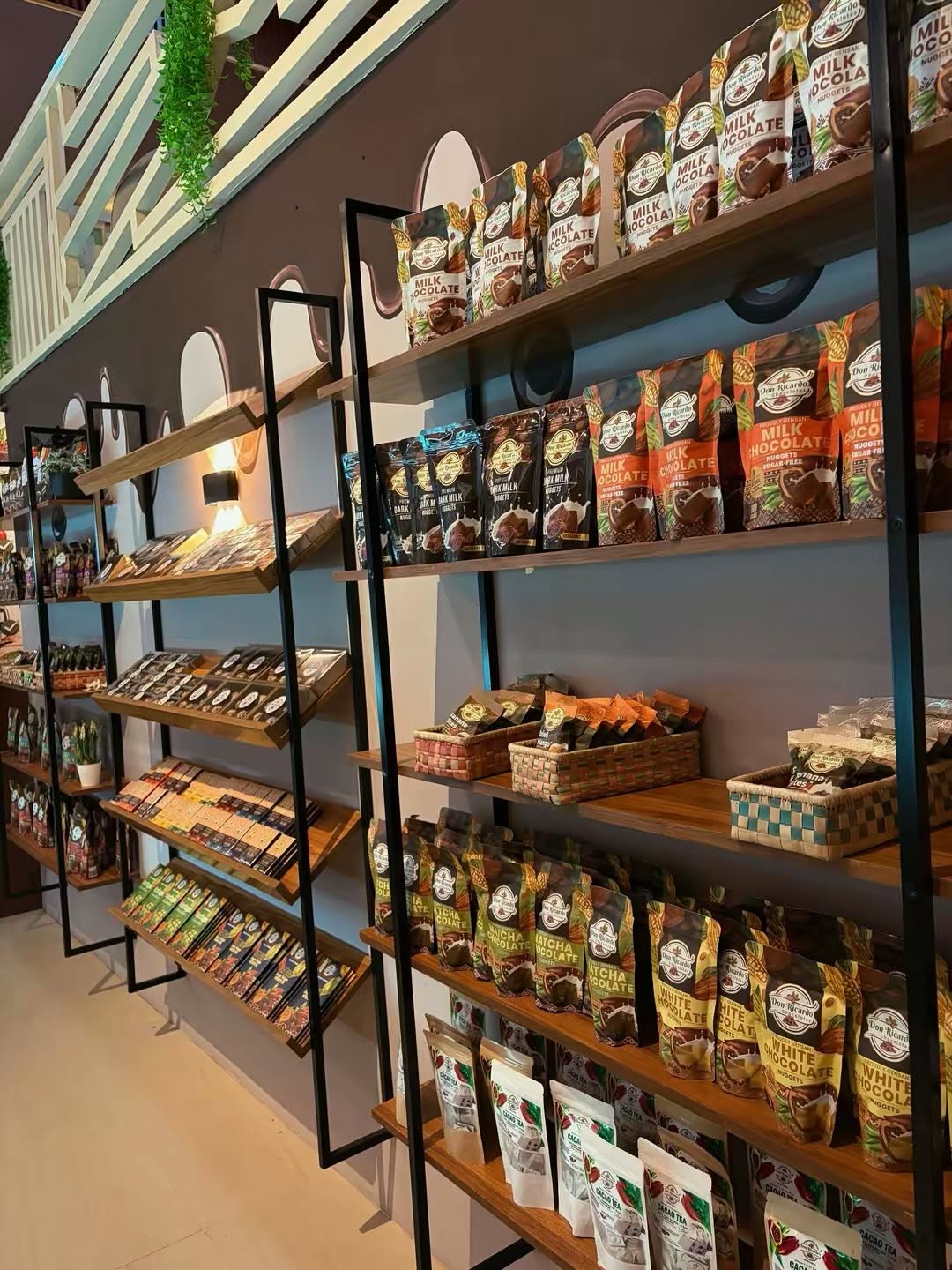 Shelves of Don Ricardo chocolate bars, nuggets, tablea, and cacao products