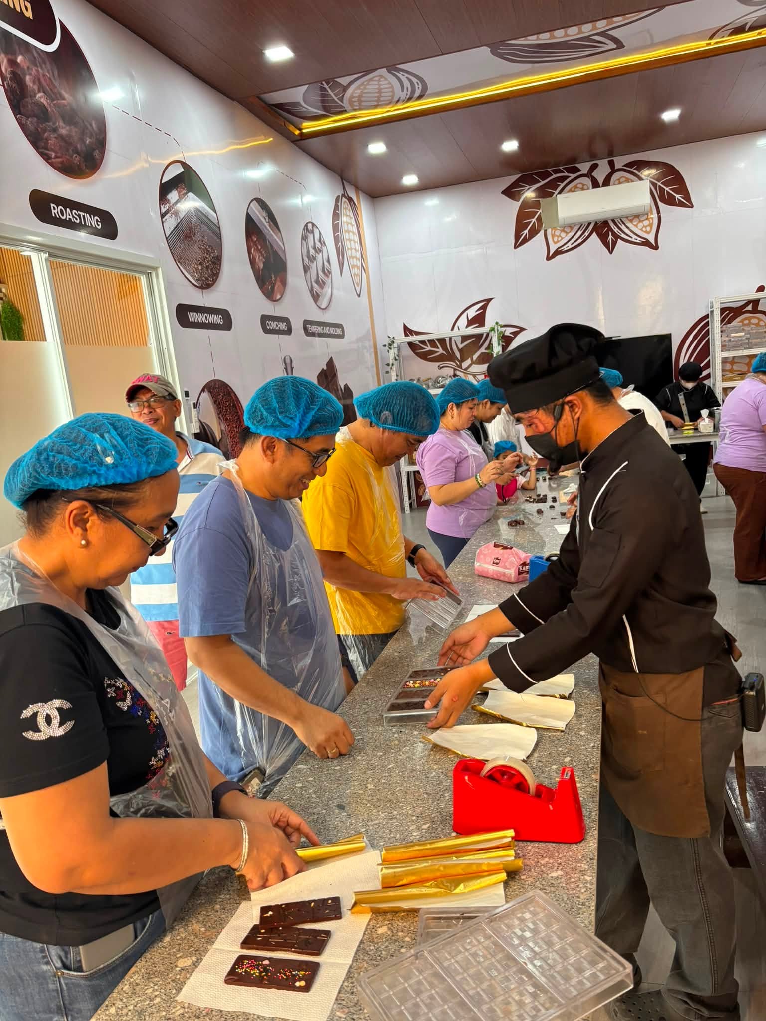Guests molding and decorating chocolate during a Don Ricardo workshop