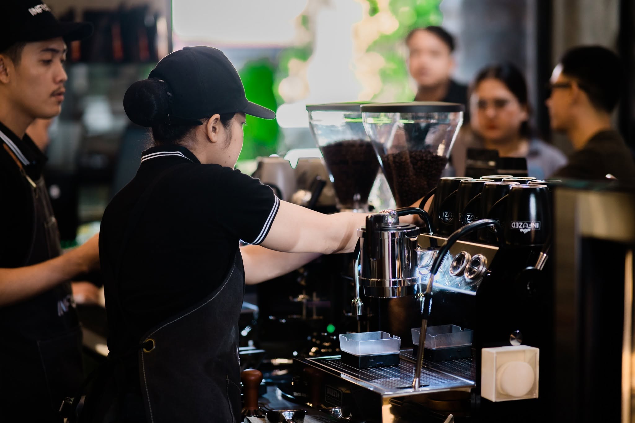 Barista preparing coffee at Infuzed Cafe Blends