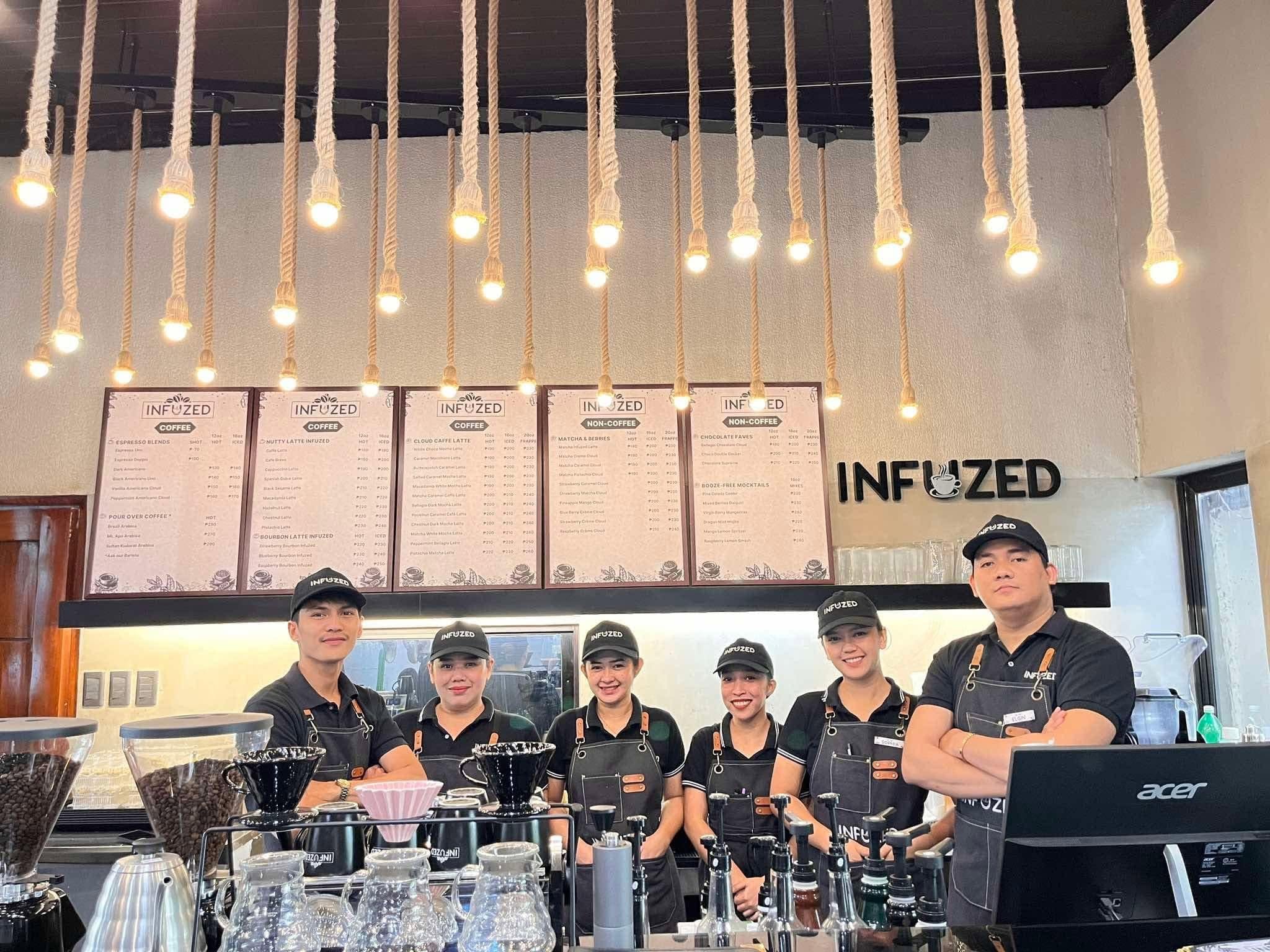 Café team behind the coffee counter at Infuzed Cafe Blends