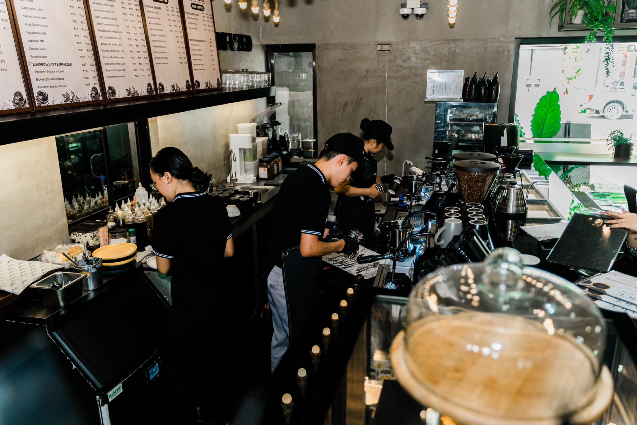 Baristas working at the coffee bar at Infuzed Cafe Blends