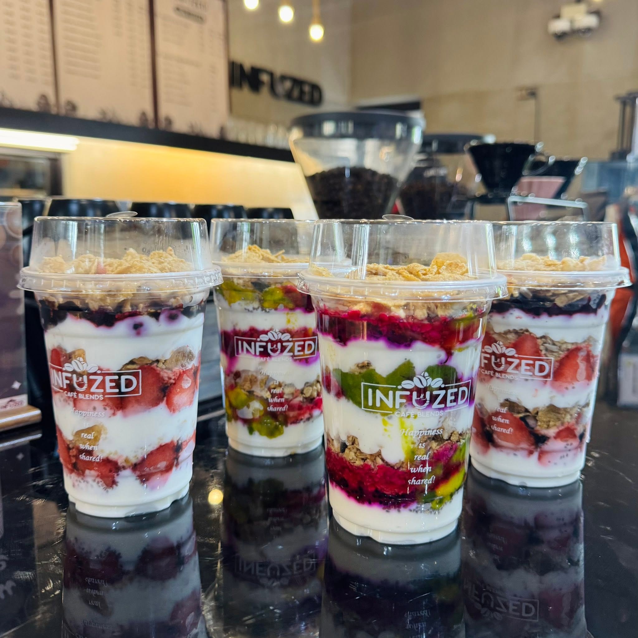 Layered fruit and yogurt cups at Infuzed Cafe Blends