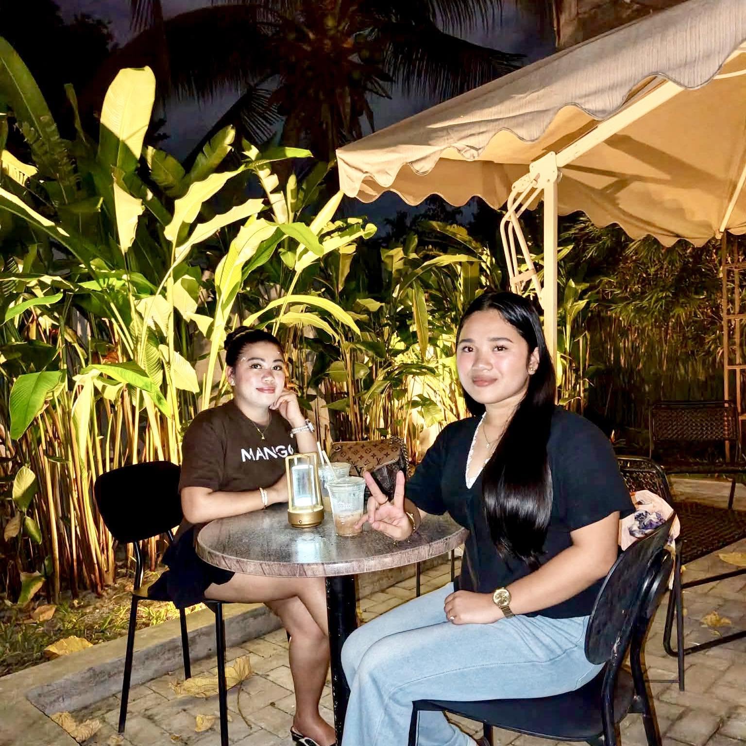 Guests at a garden table at Infuzed Cafe Blends