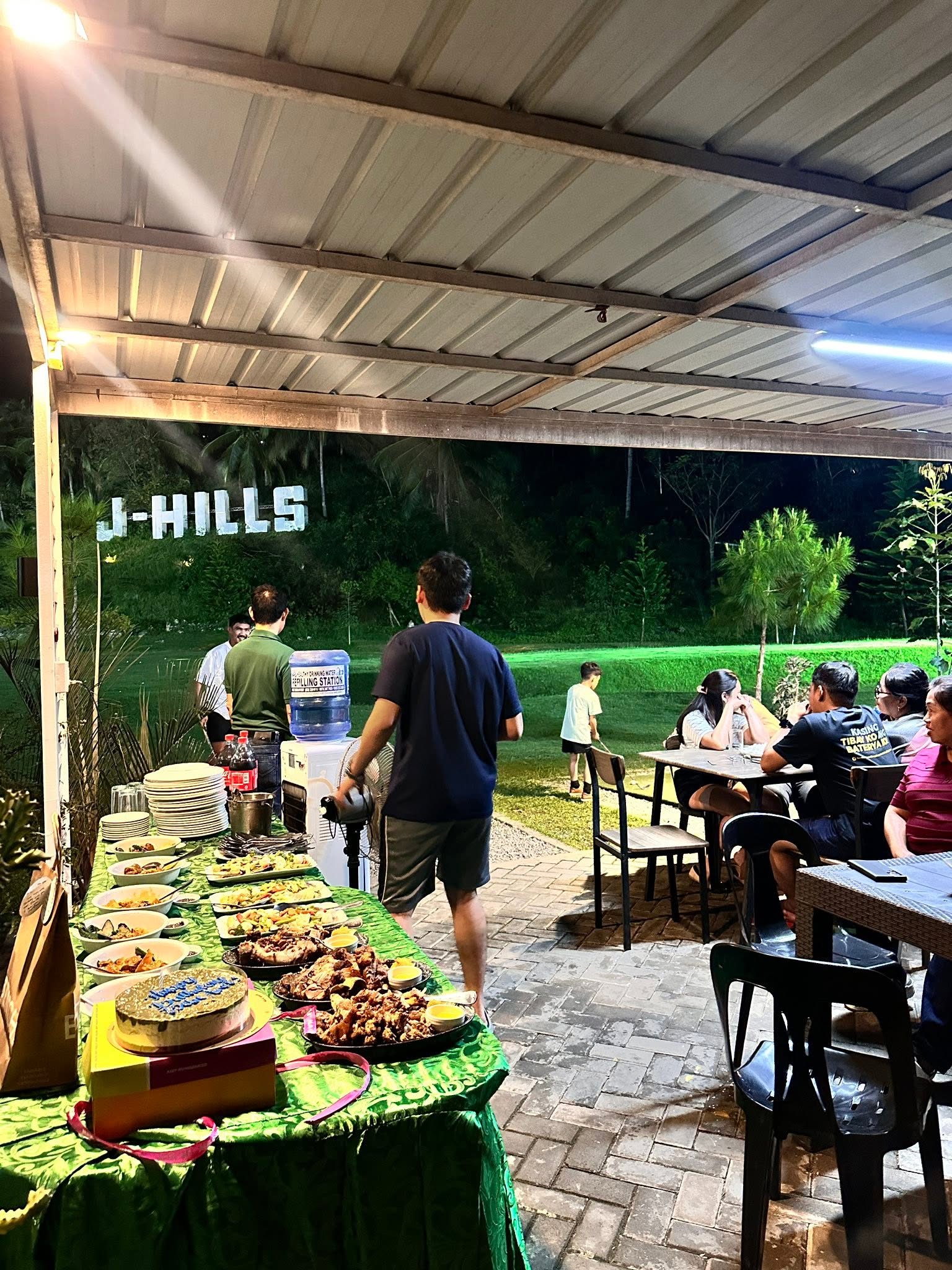 Evening celebration buffet and diners beside the J-Hills range
