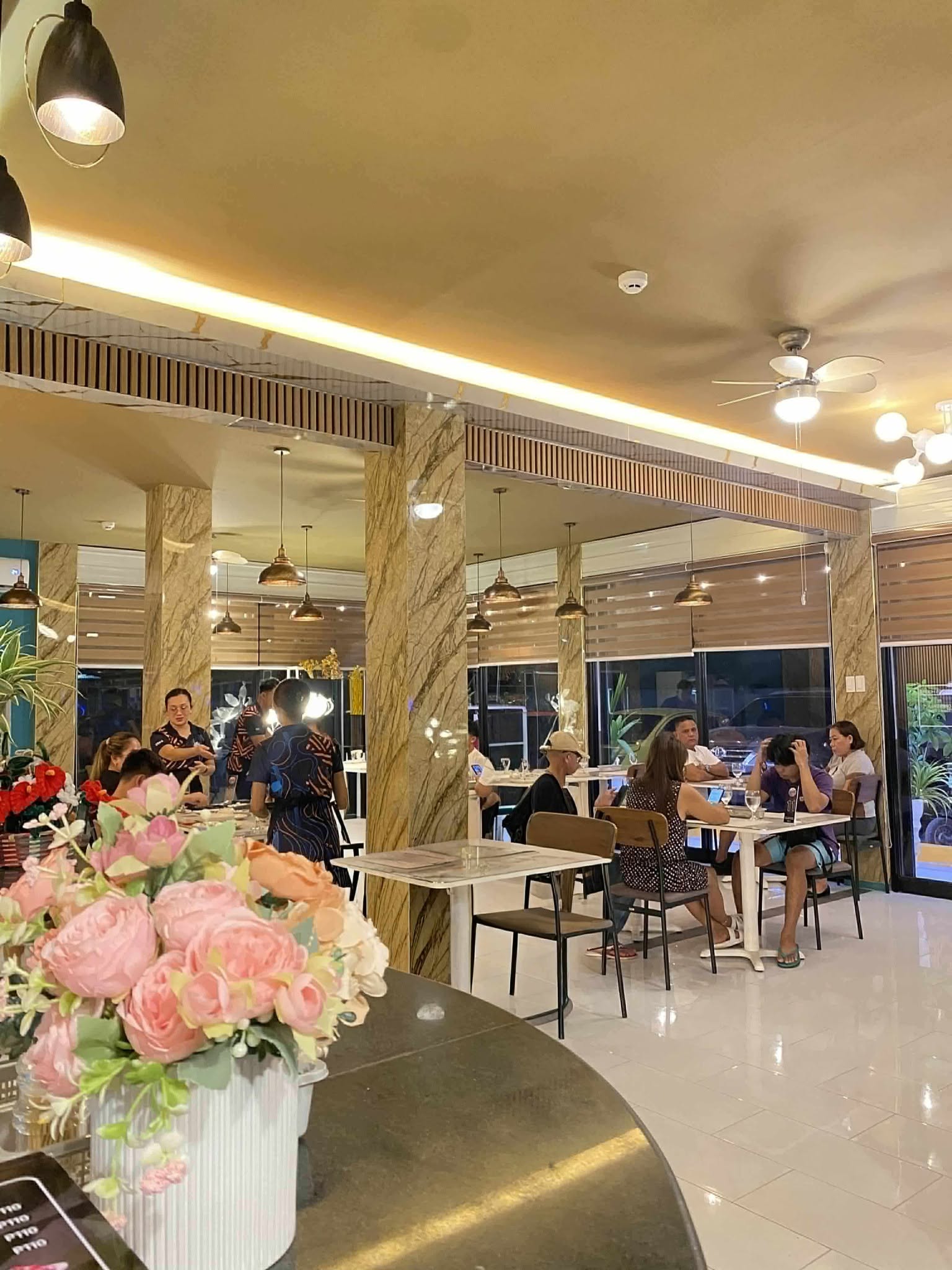 Guests dining inside Kusina Singko in the evening