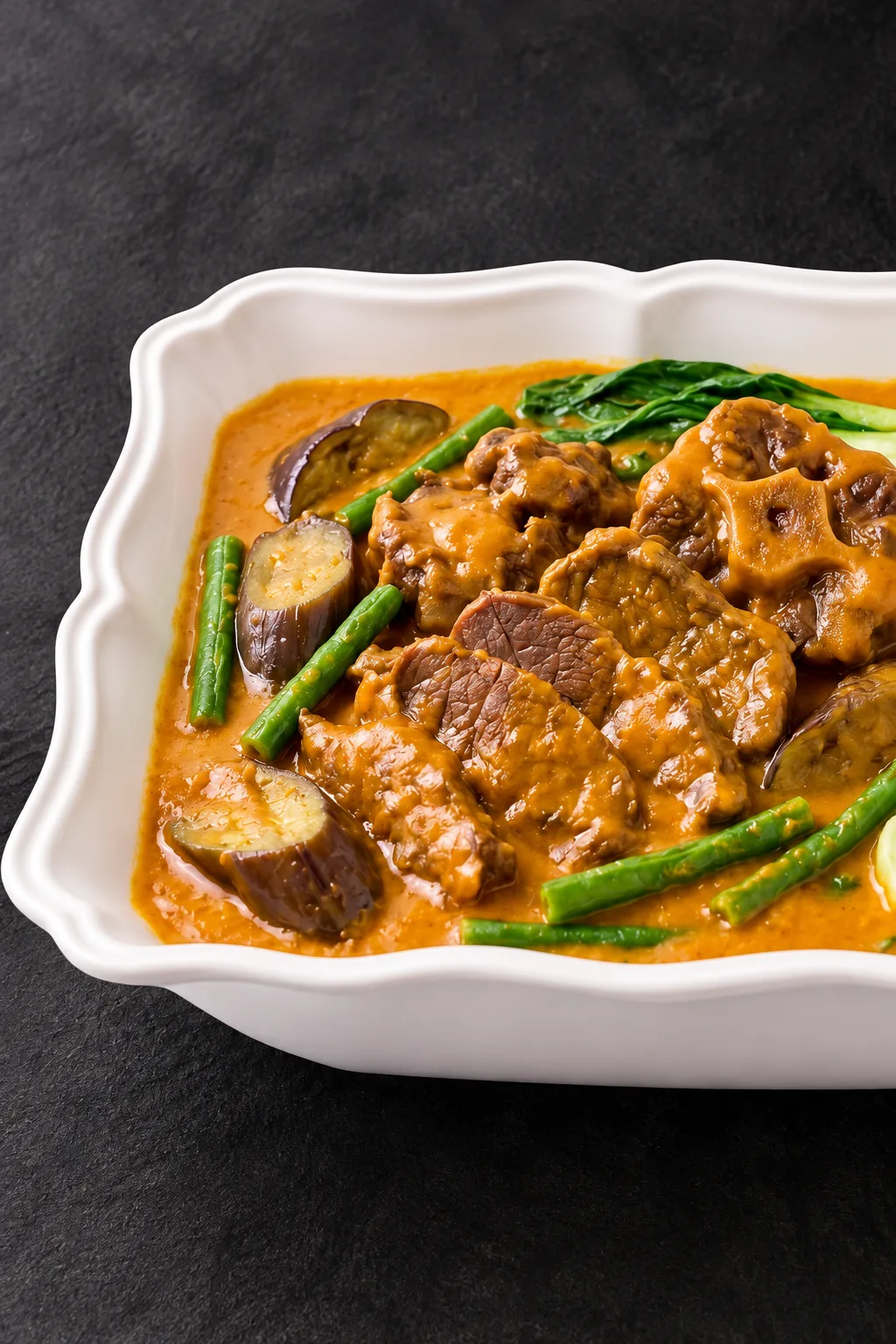 Kare-kare with meat, eggplant, green beans and leafy vegetables