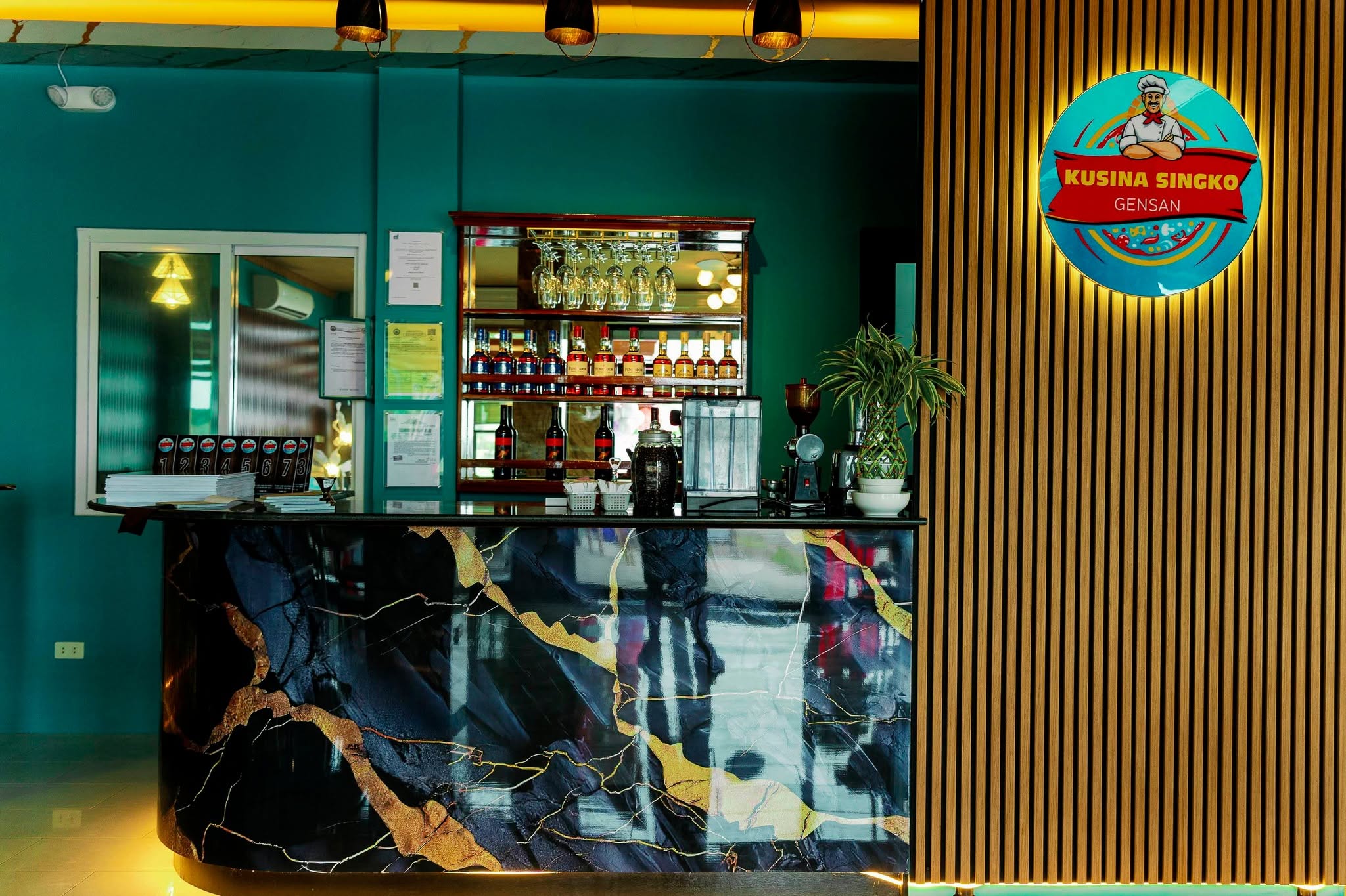 Restaurant counter and Kusina Singko wall sign