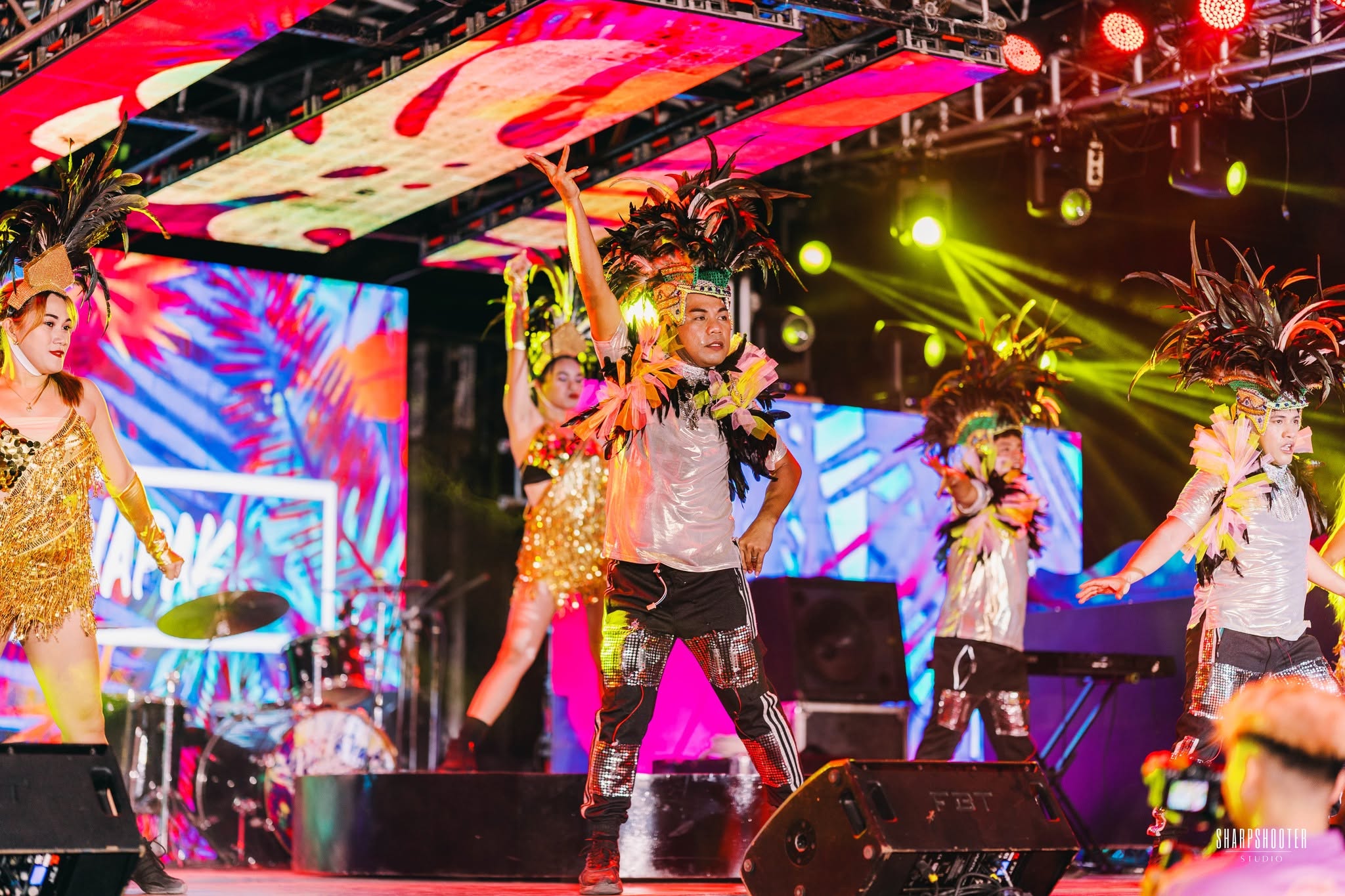 Group performance on stage during an event at London Beach Resort