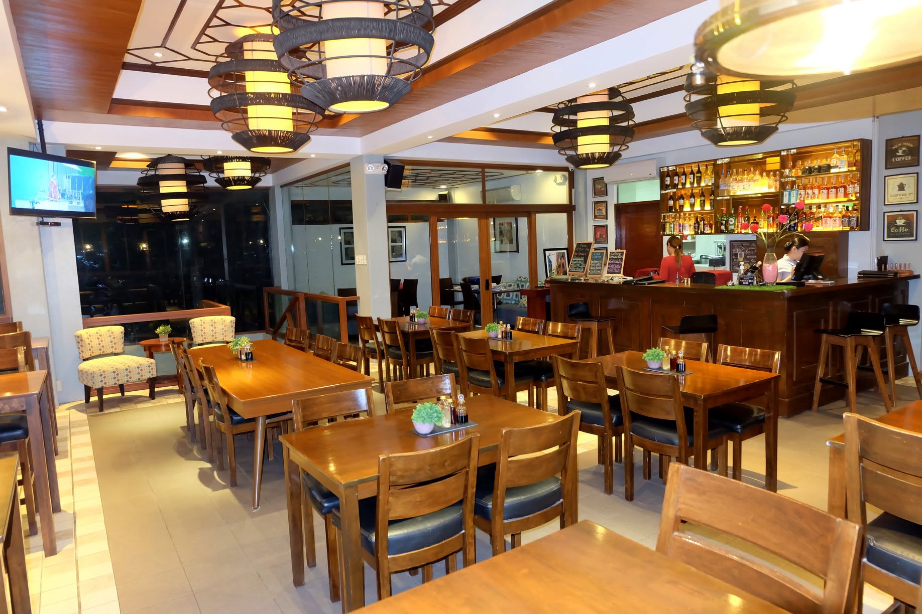 Restaurant tables and bar at London Beach Resort