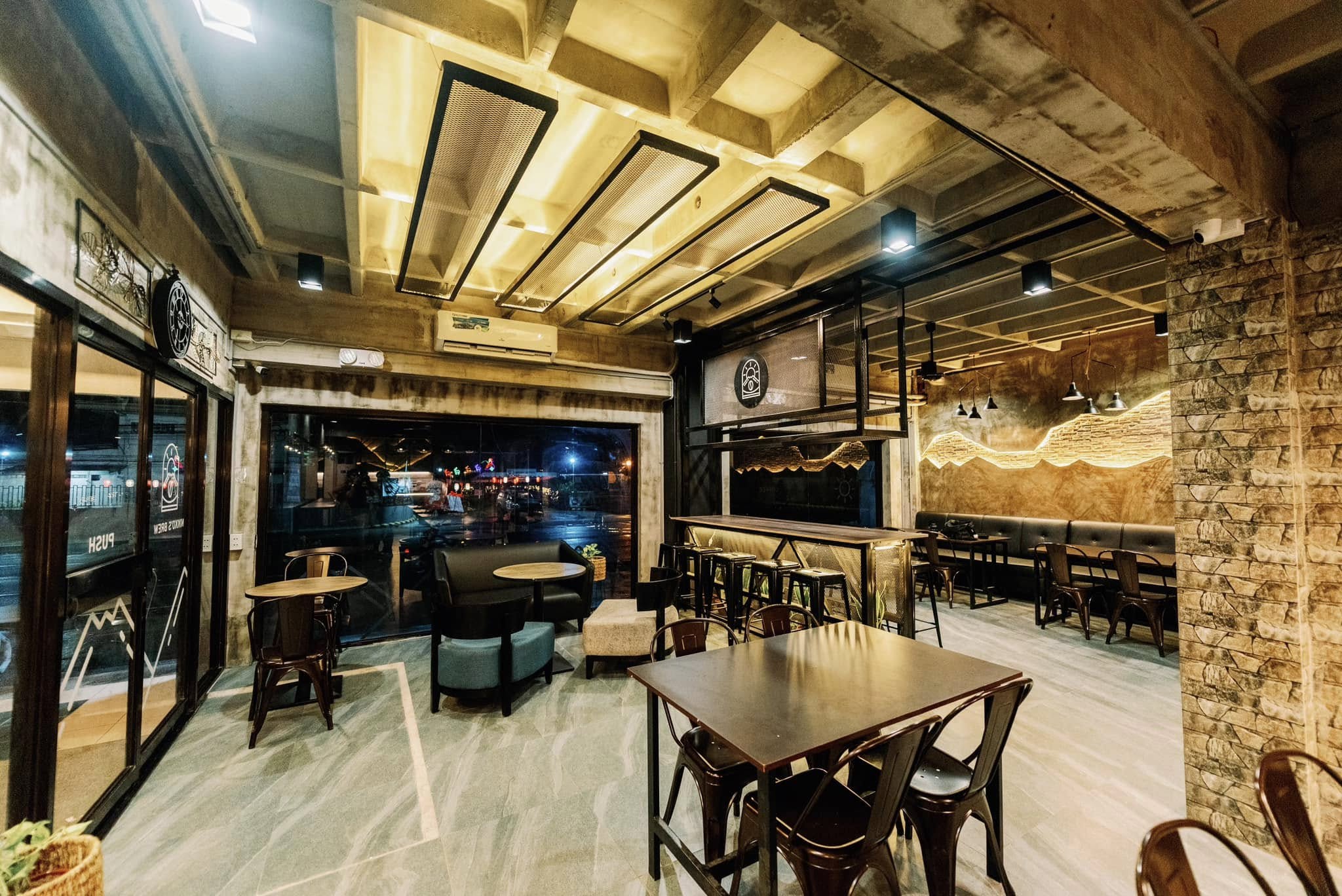 Dining tables and lounge seating inside Nikko's Brew