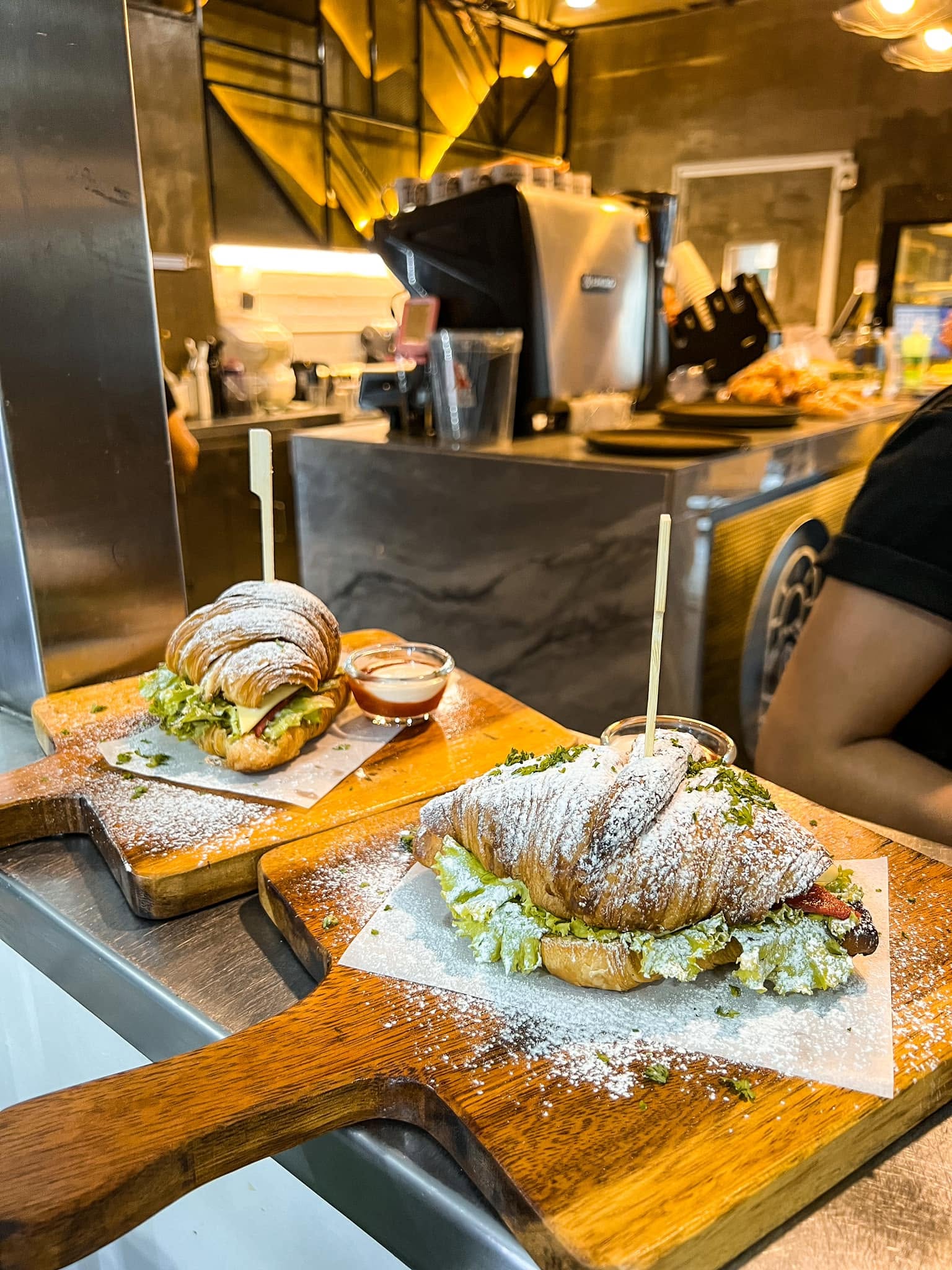 Croissant sandwiches prepared at Nikko's Brew