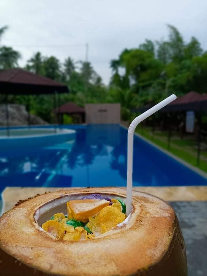 Dessert served in a coconut beside the swimming pool