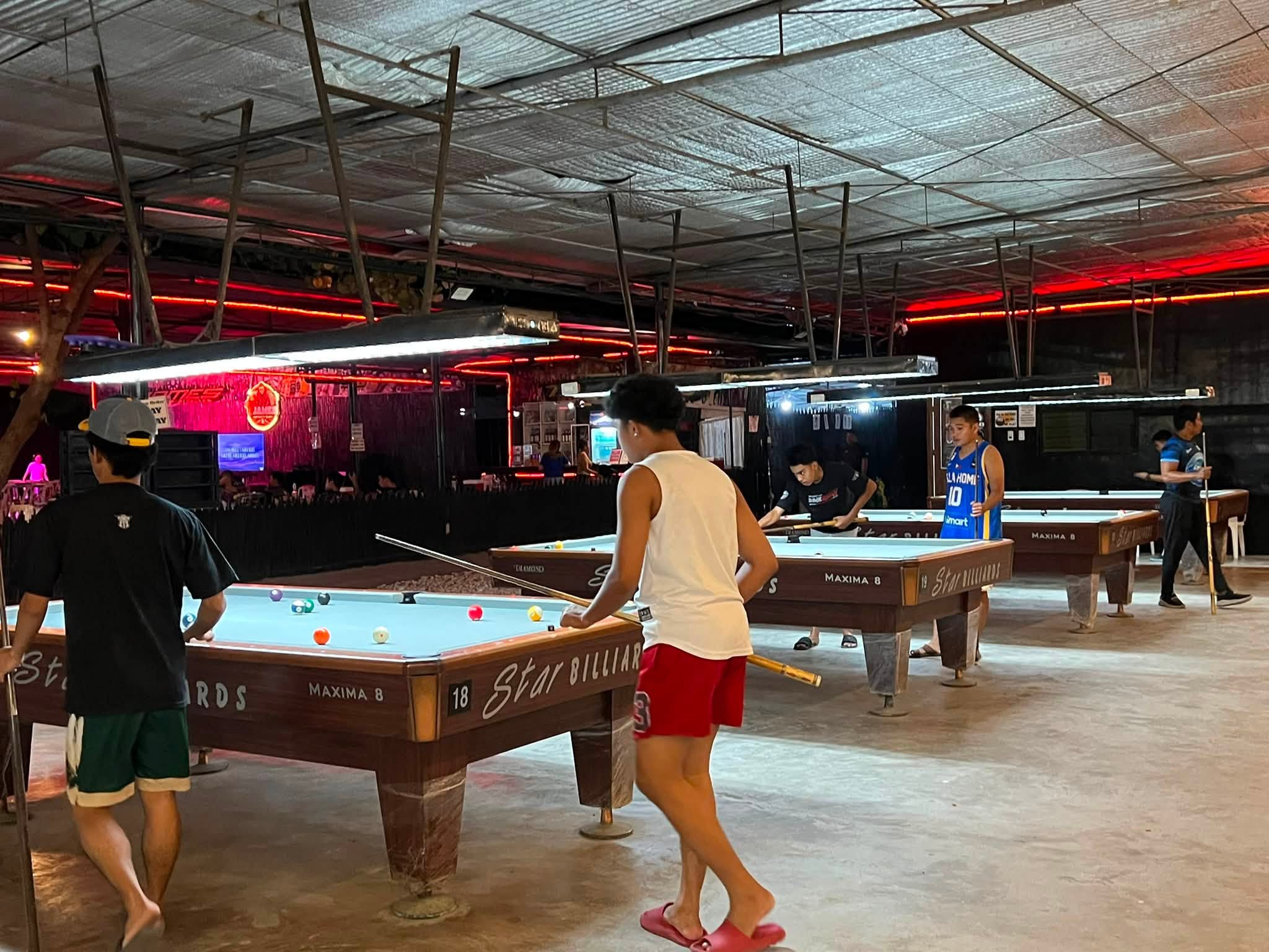Players at the billiards tables at T-James Sporty Bar